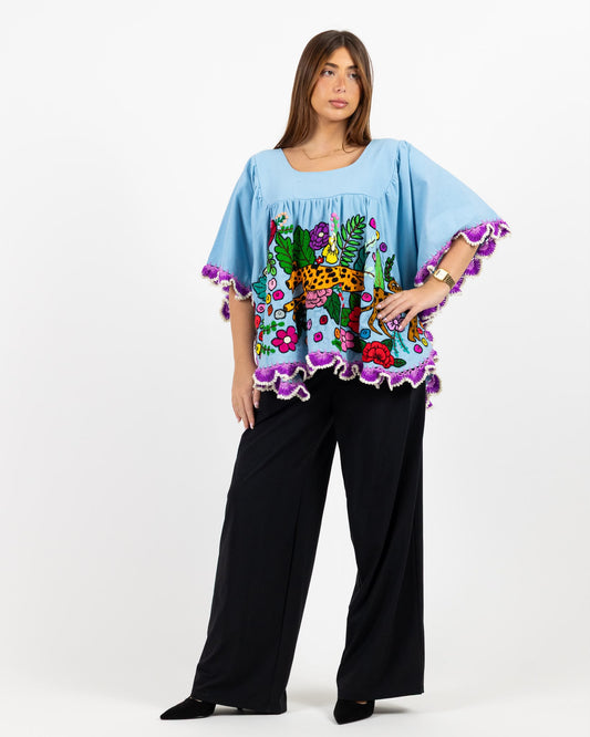 Blue short sleeve cotton top with hand stitched animal print